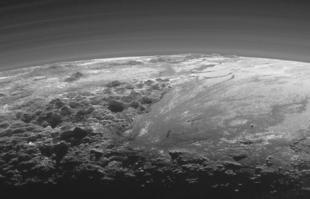 Horizon of Pluto with Norgay Montes (left) and Sputnik Planum (right). Credit: NASA/Johns Hopkins University/Southwest Research Institute.